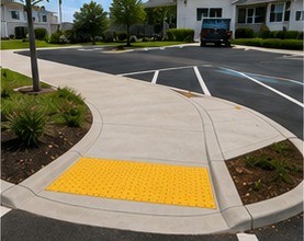 ADA-accessible concrete curb ramp